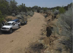 Looking downstream before wooden post vanes are installed to protect eroding bank on photo right.